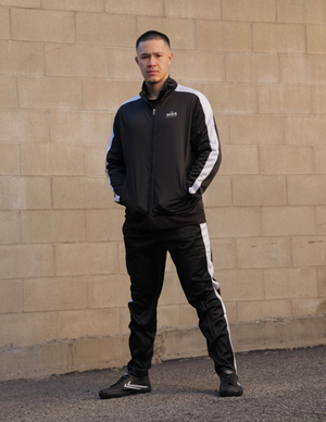 Model wearing Limited Edition Black Tracksuit